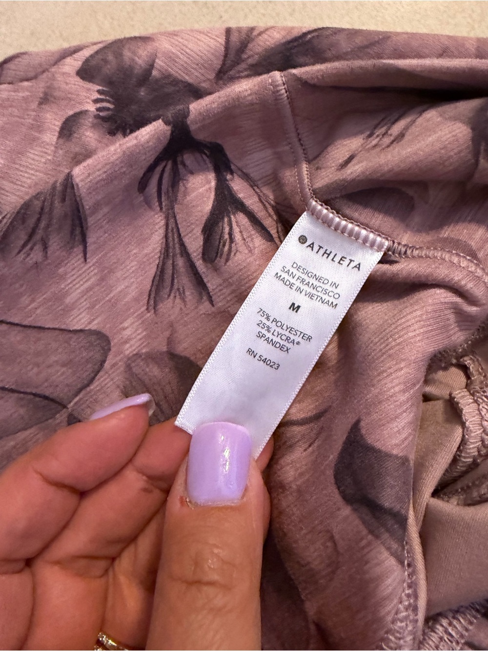 Athleta Mauve Floral Salutation Stash pocket leggings